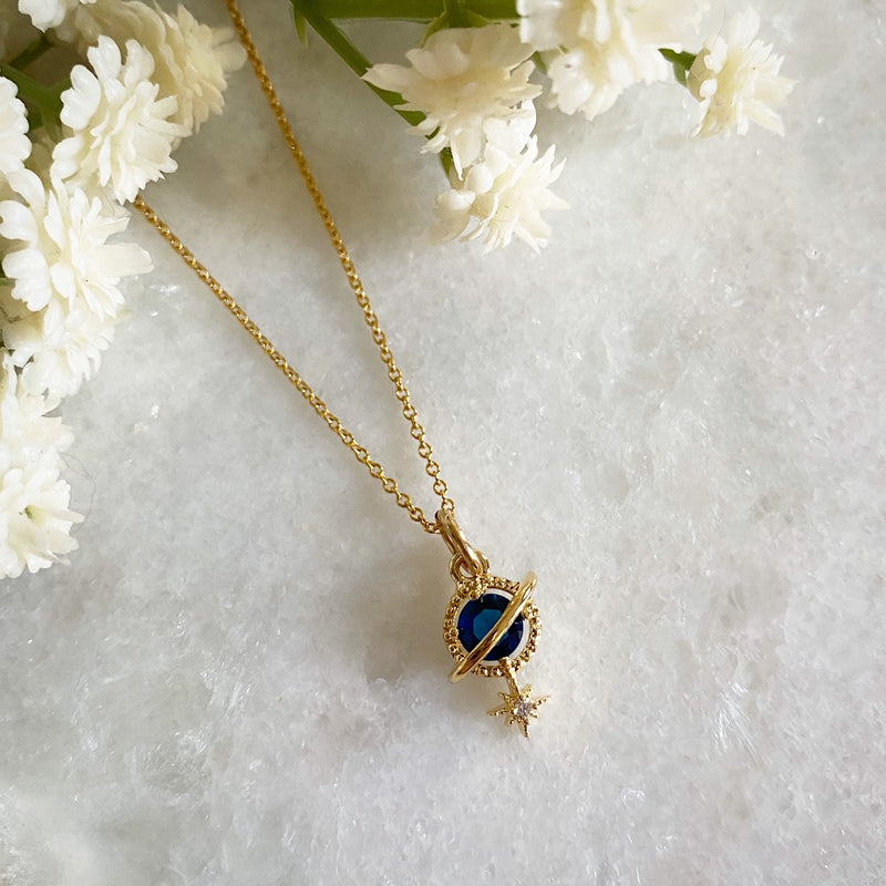 Orion Navy Planet and Star Necklace Wisteria London